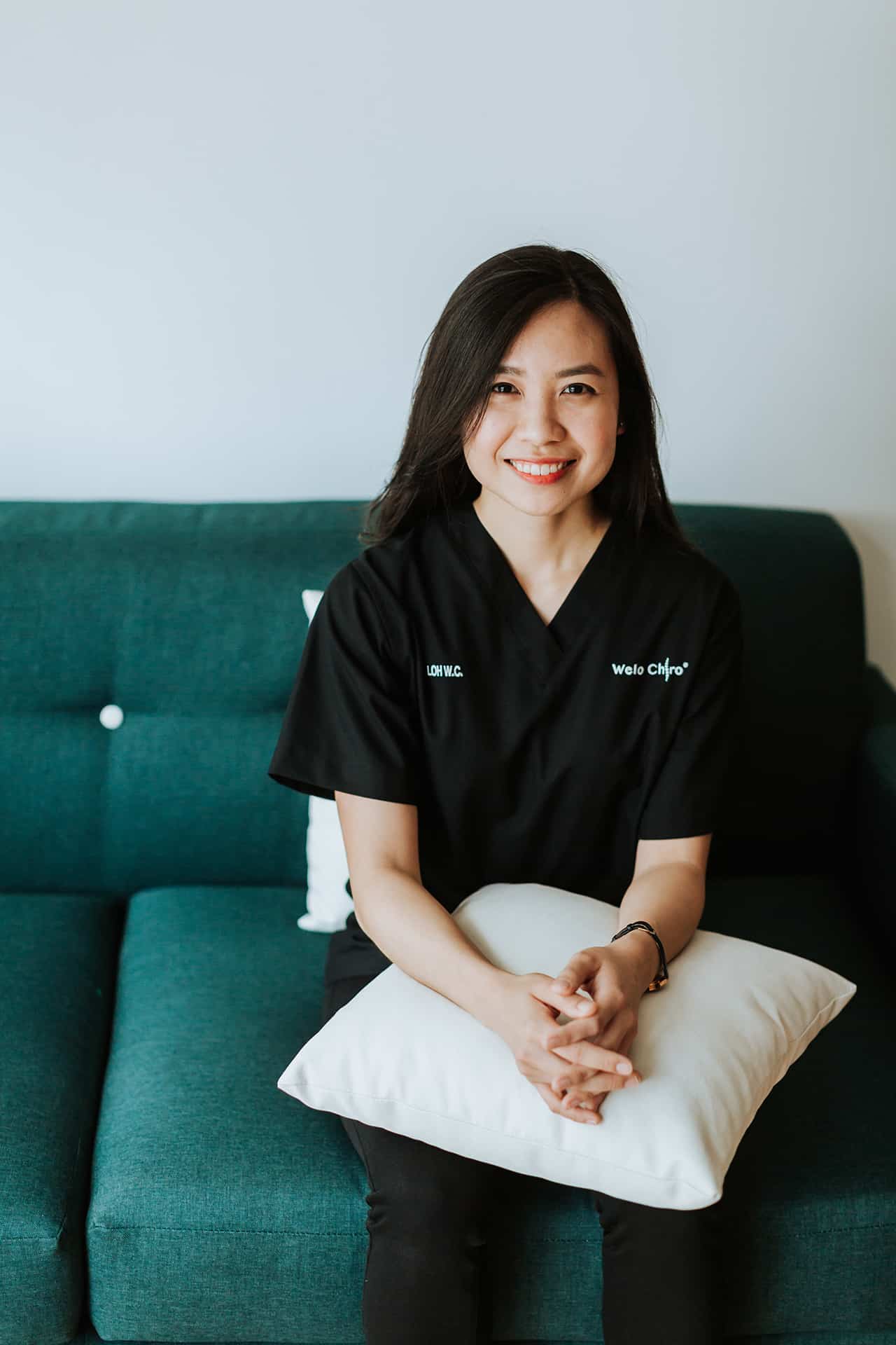 Portrait of Dr Loh Wei Chee in black Welo scrubs