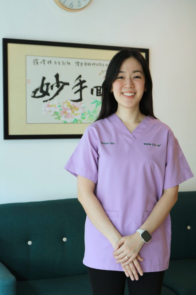 Portrait of Dr Sarah in lavender scrubs