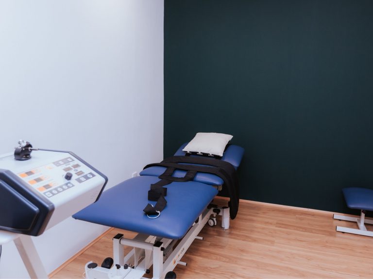 The treatment room at Welo Chiropractic Damansara Jaya, with a traction table